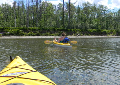 Relaxing while kayaking on the Restigouche River